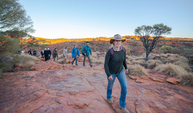 People hiking through outback Australia