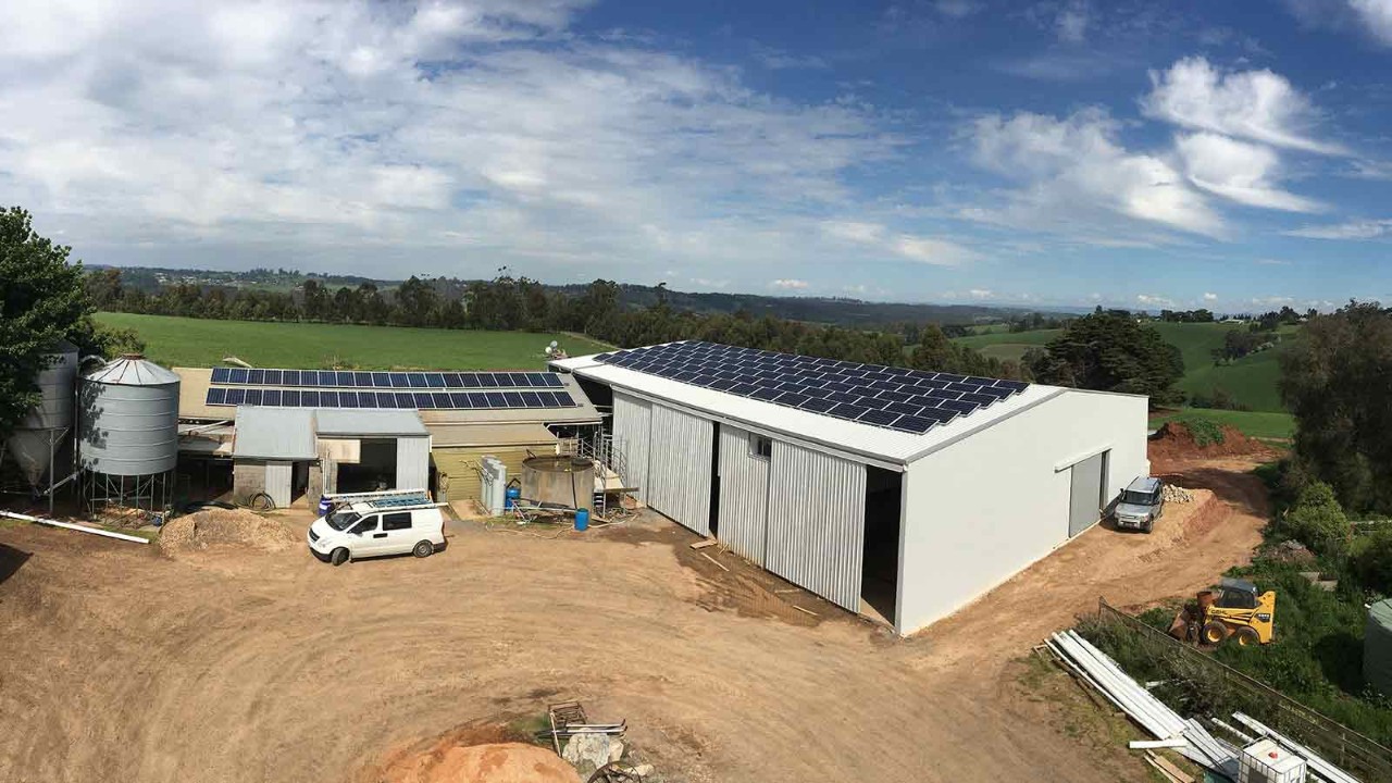 Aerial view of a shed fitted with solar panels. 