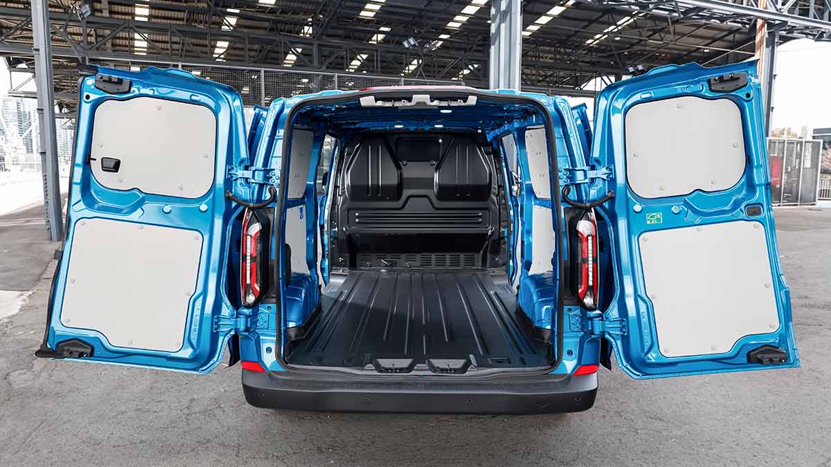 Cargo area inside blue LWB Ford E-Transit Custom van with rear barn doors open.