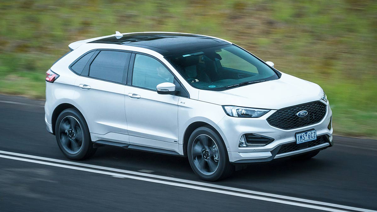 A white Ford Endura ST-Line 2019 car in motion on a road