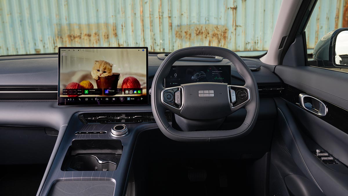 Dashboard of Geely EX5 SUV with large touchscreen and egg-shaped steering wheel