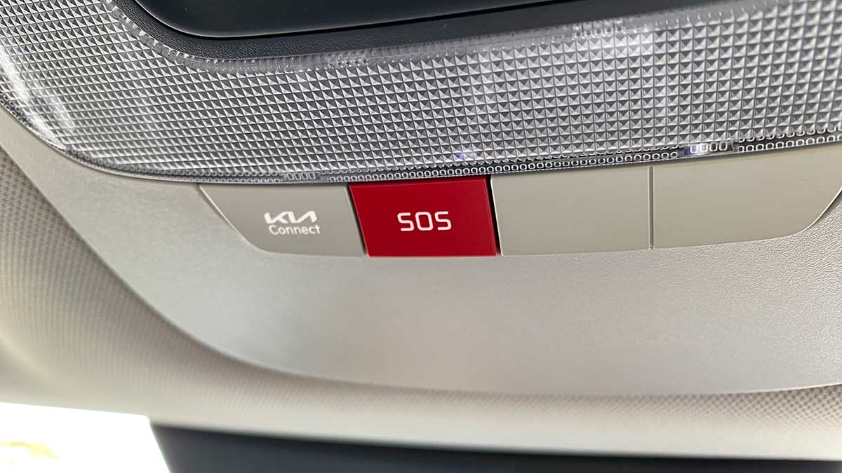2026 Kia Sportage SX overhead console showing red SOS emergency call button