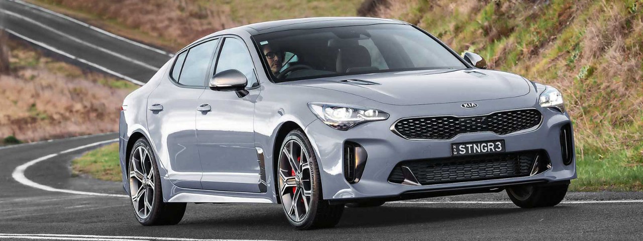 MY18 Kia Stinger Grey Kia Stinger 330 GT drives up a winding road
