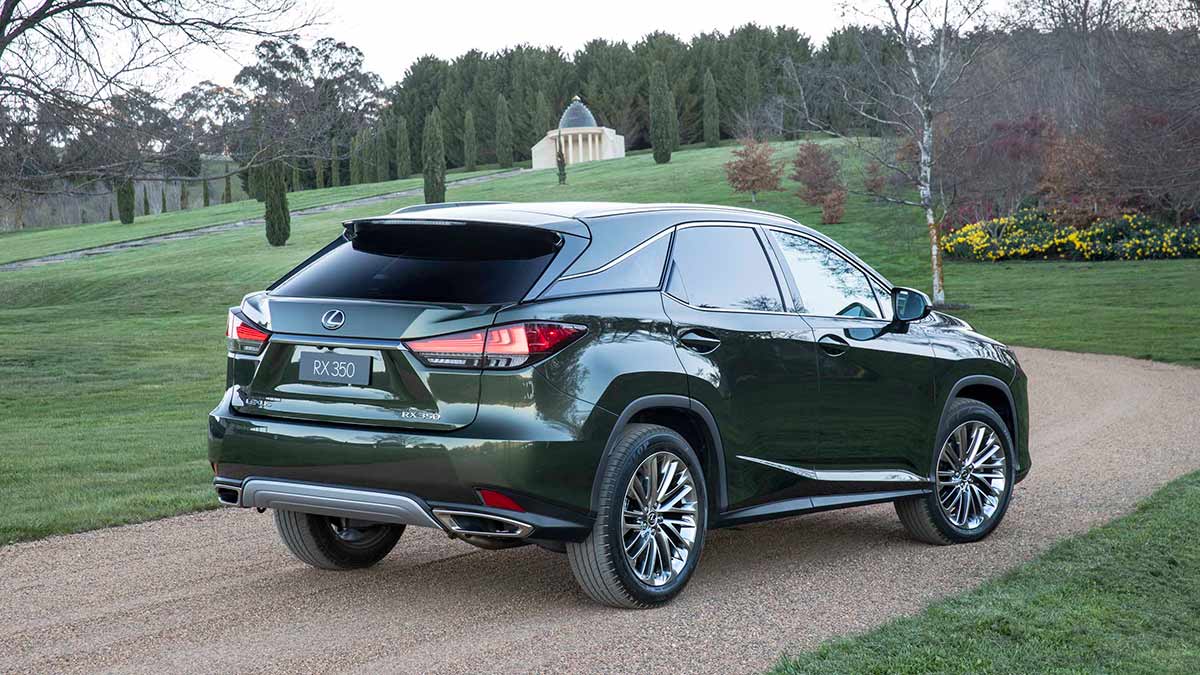 Green Lexus RX300 parked on driveway