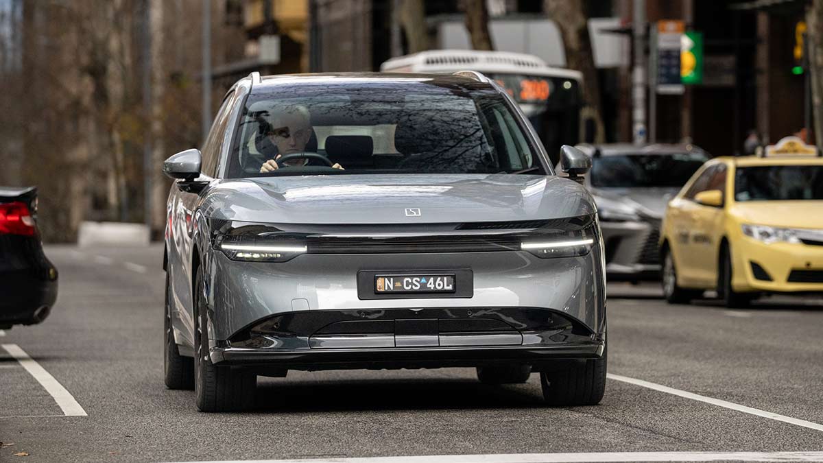 Metallic grey Zeekr 7X electric medium SUV surrounded by traffic in Melbourne CBD.