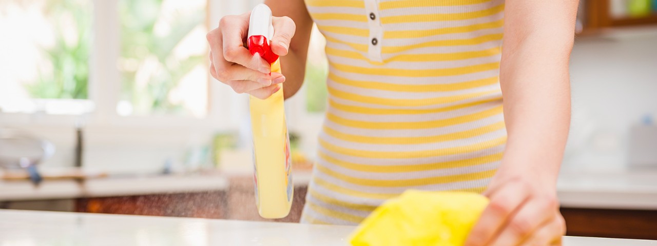 905559600 Person cleaning kitchen bench