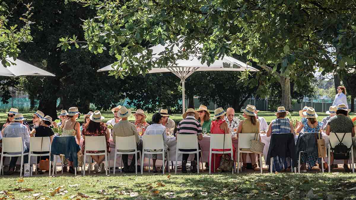 Long table with 20 diners at food festival event