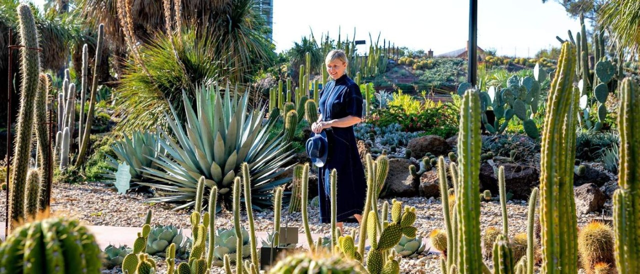 A woman walking through a cactus display at the free-to-enter Royal Botanic Gardens Melbourne