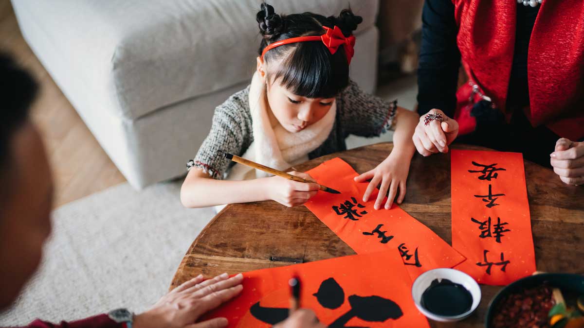 Young girl gets ready for Chinese New Year. 