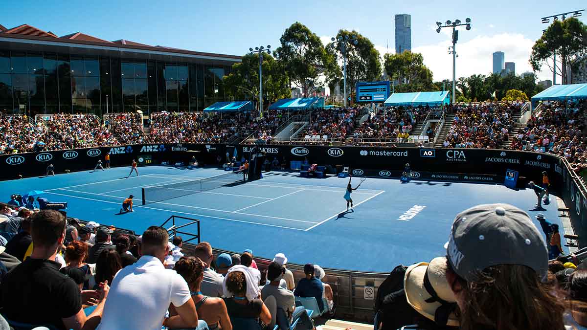 Tennis fans watch match at an outside court at the Australian Open