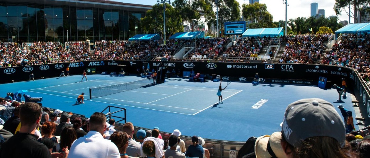 Tennis fans watch match at an outside court at the Australian Open