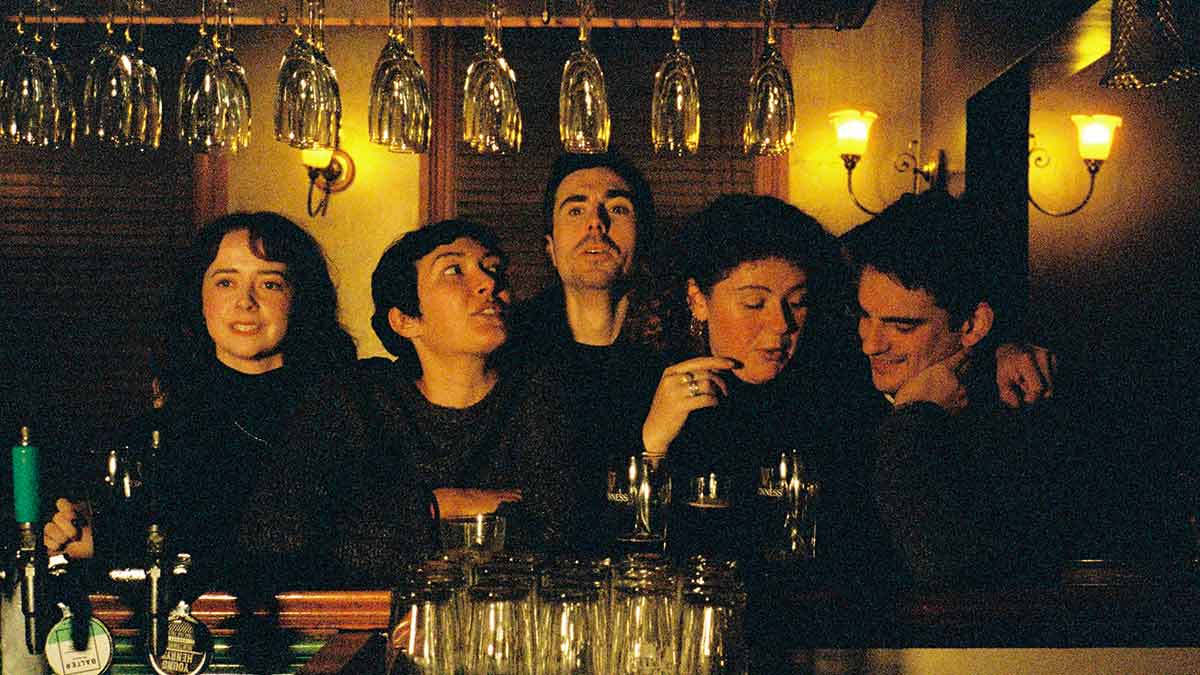 Five Australian actors in a bar scene from the play Never Closer.