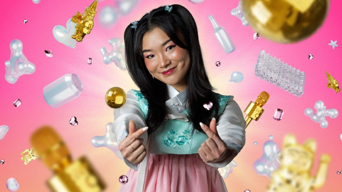 young Korean-Australian woman making heart symbol with her fingers