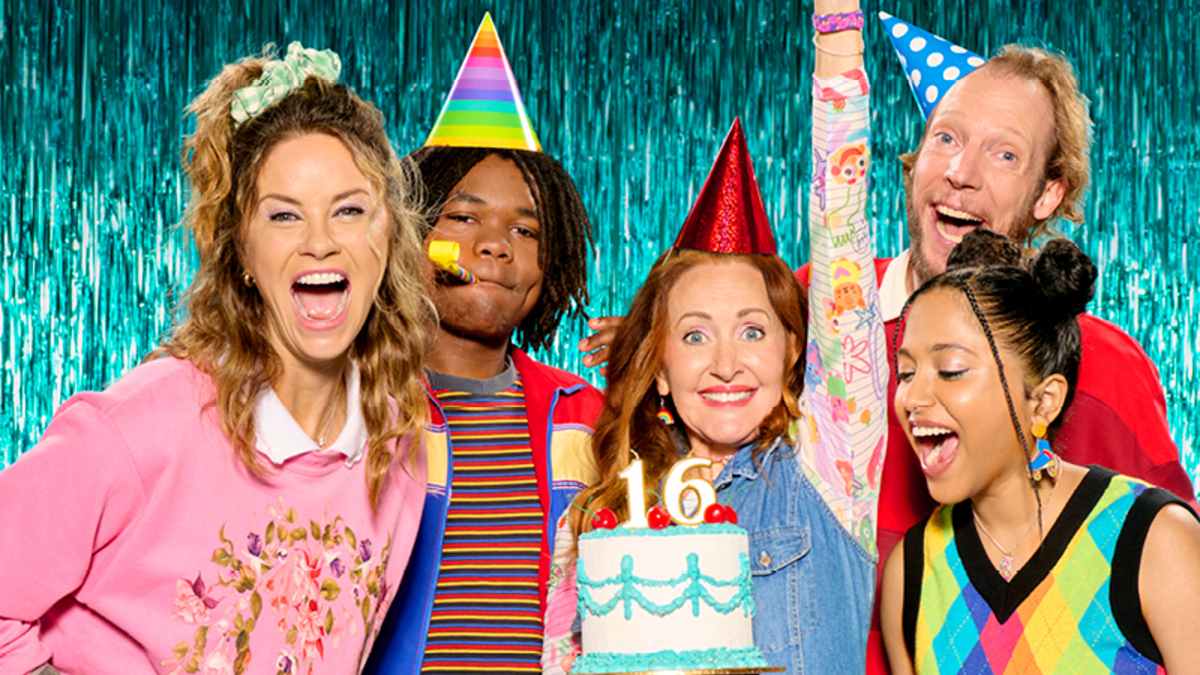 five actors on stage dressed in birthday party outfits