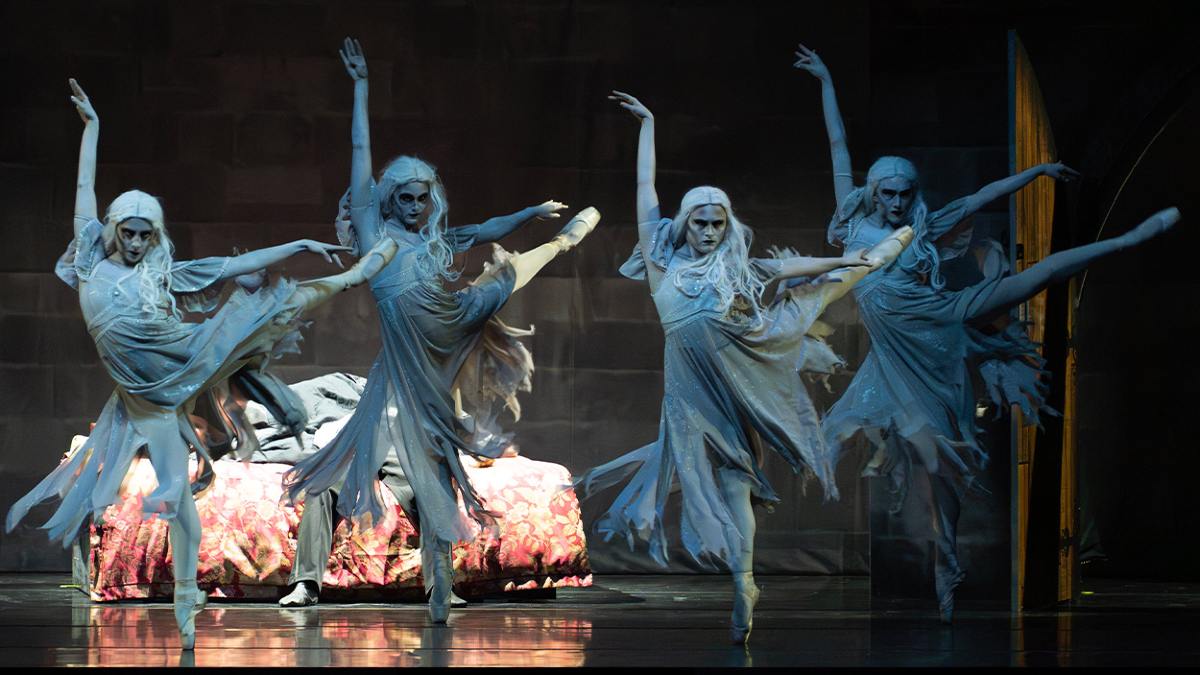 four ballerinas performing Dracula