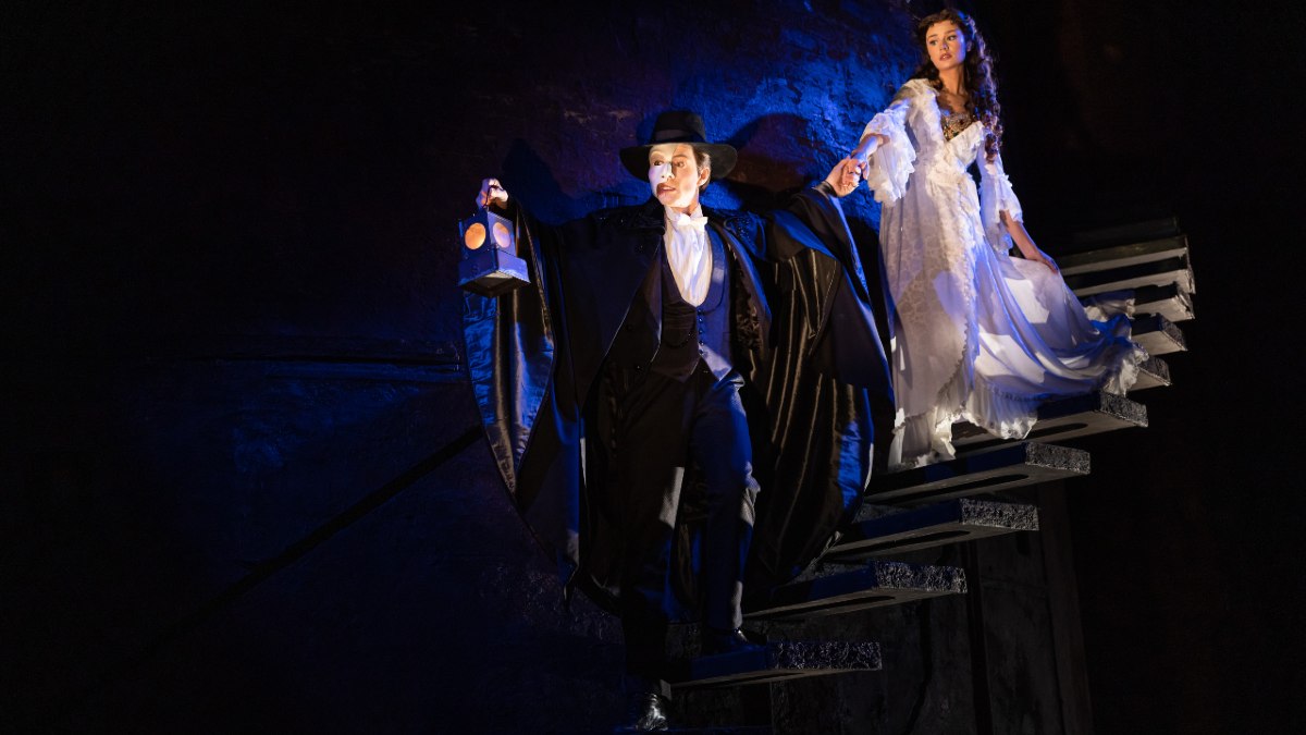 The Phantom of the Opera leading Christine into the sewers