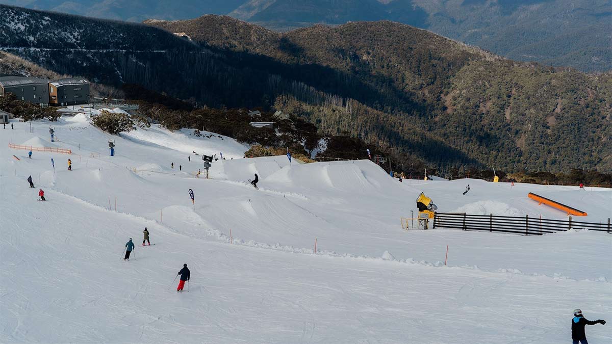 Snowy mountain with people skiing