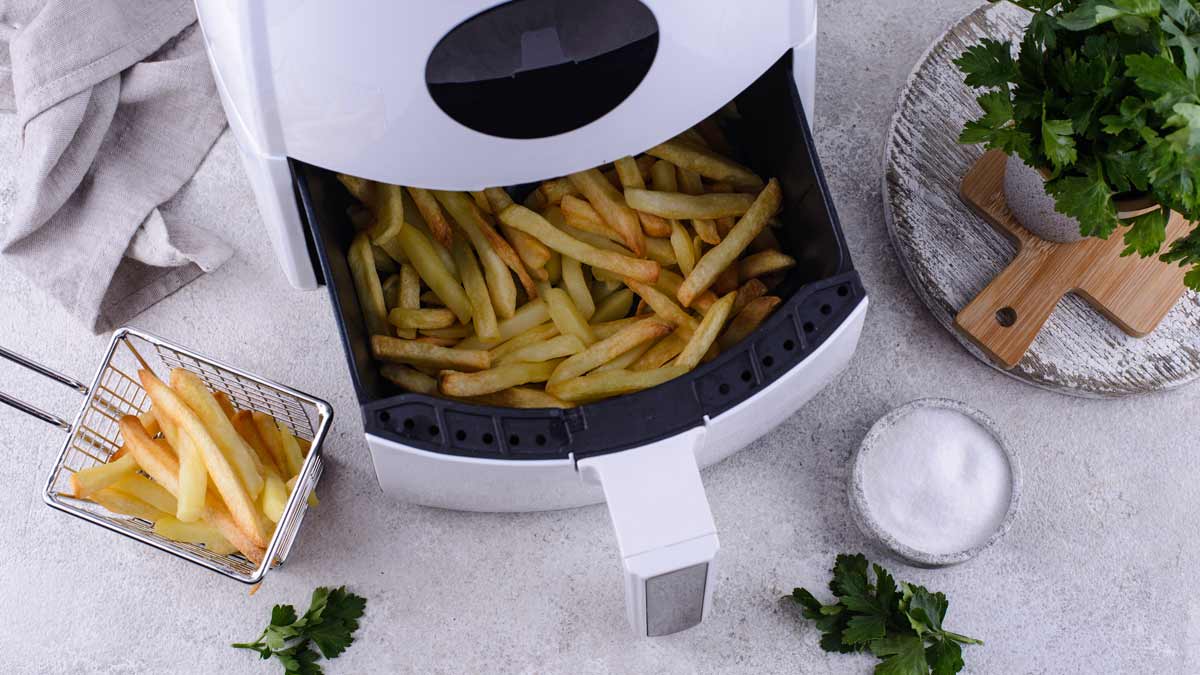 Crispy chips in open air fryer drawer.