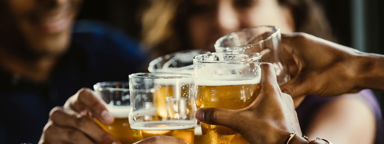 1295737155 Friends clinking beer glasses