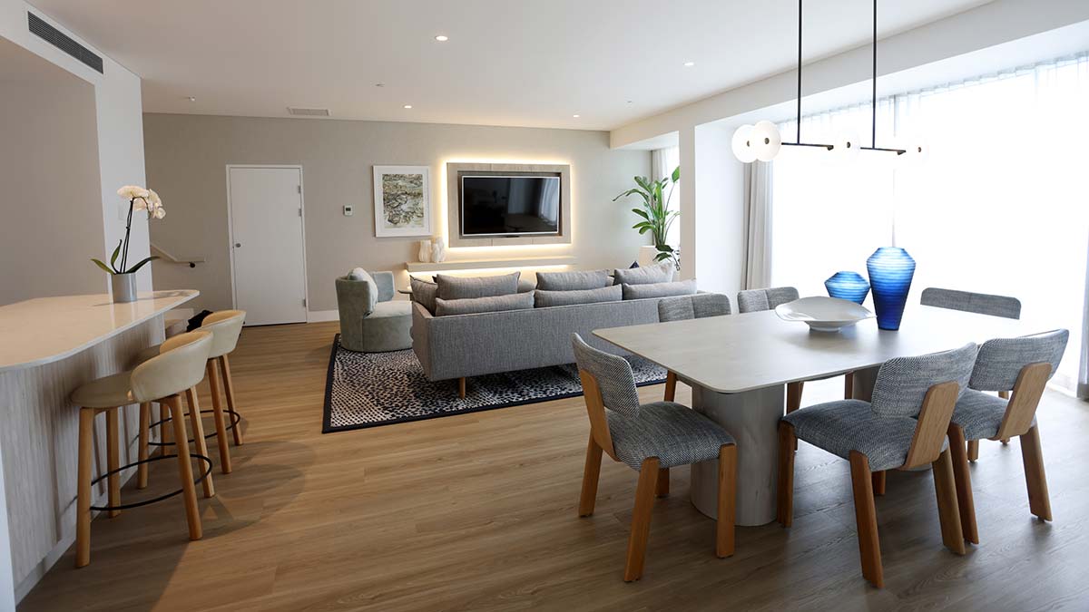 Open-plan kitchen, dining and living room in the Royal Suite at Royal Pines Resort