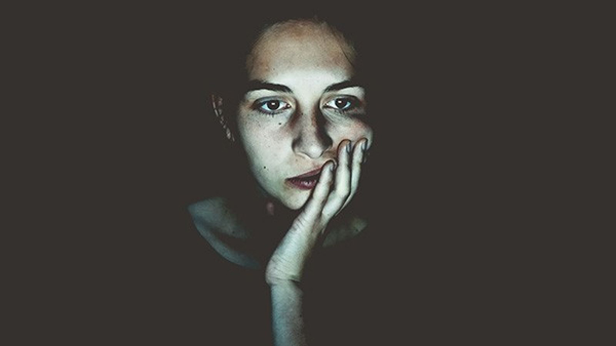 Woman looking into a computer screen
