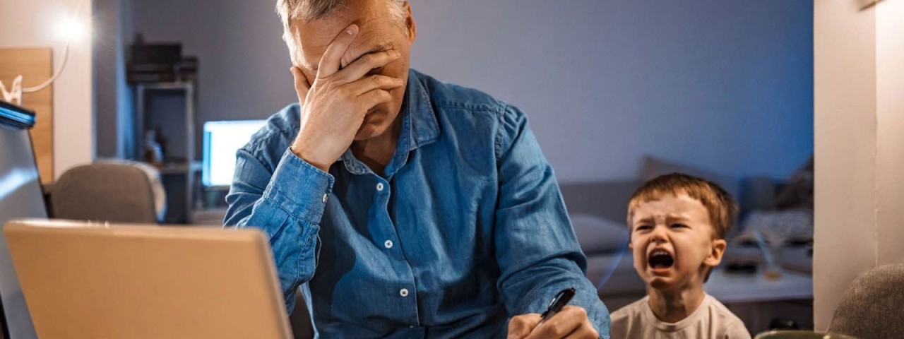 Man stressed working from home
