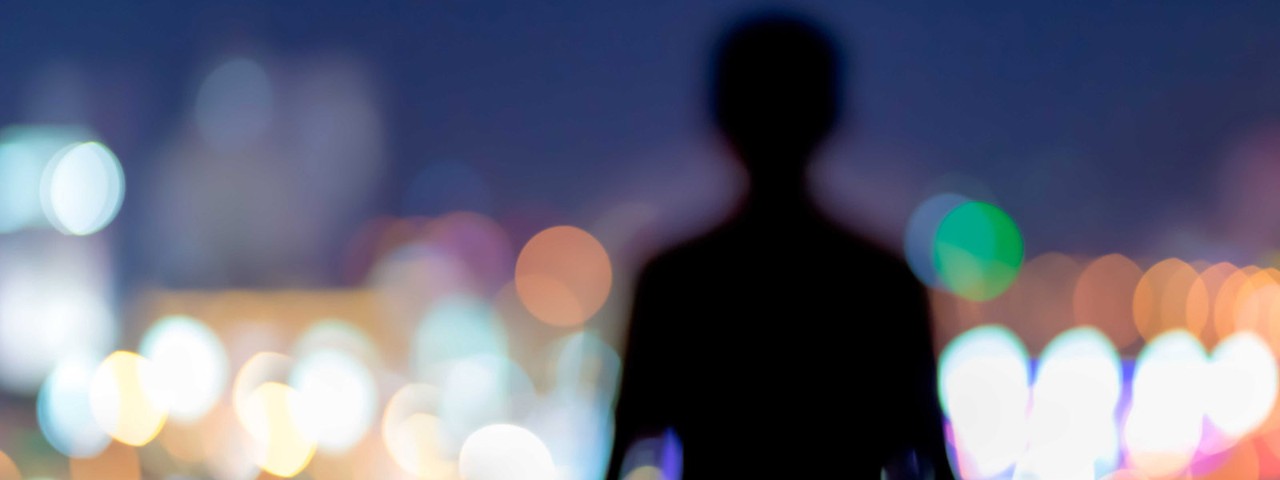 A shadow with lights behind
