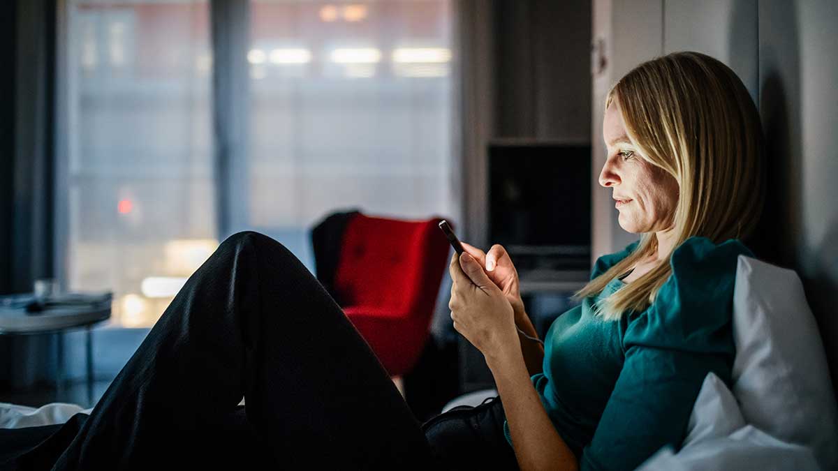 Woman texting feeling down