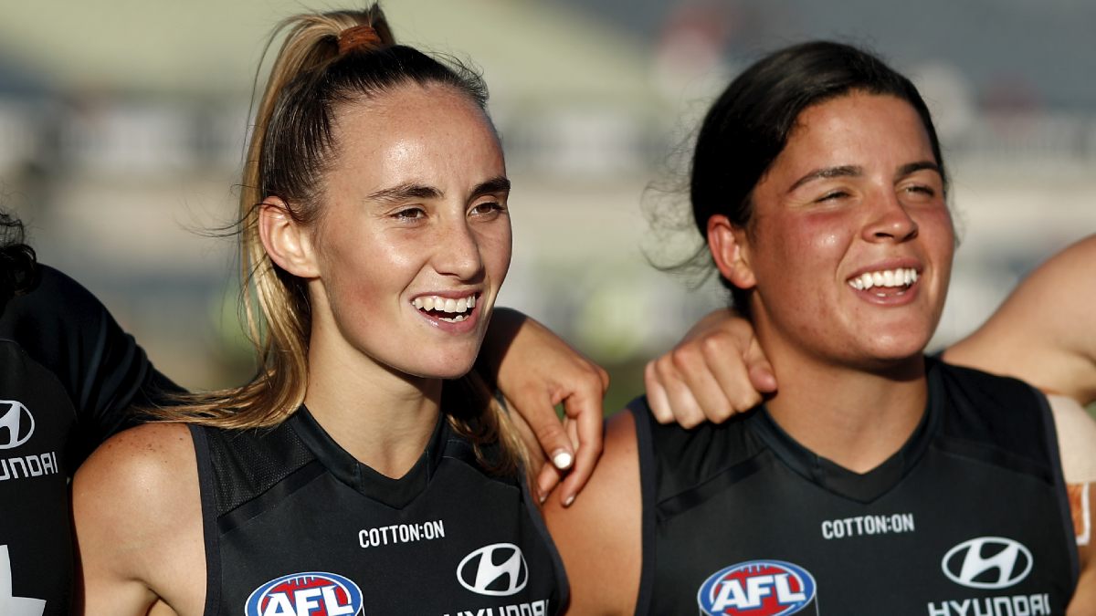AFLW player Georgia Gee singing her team song after a game