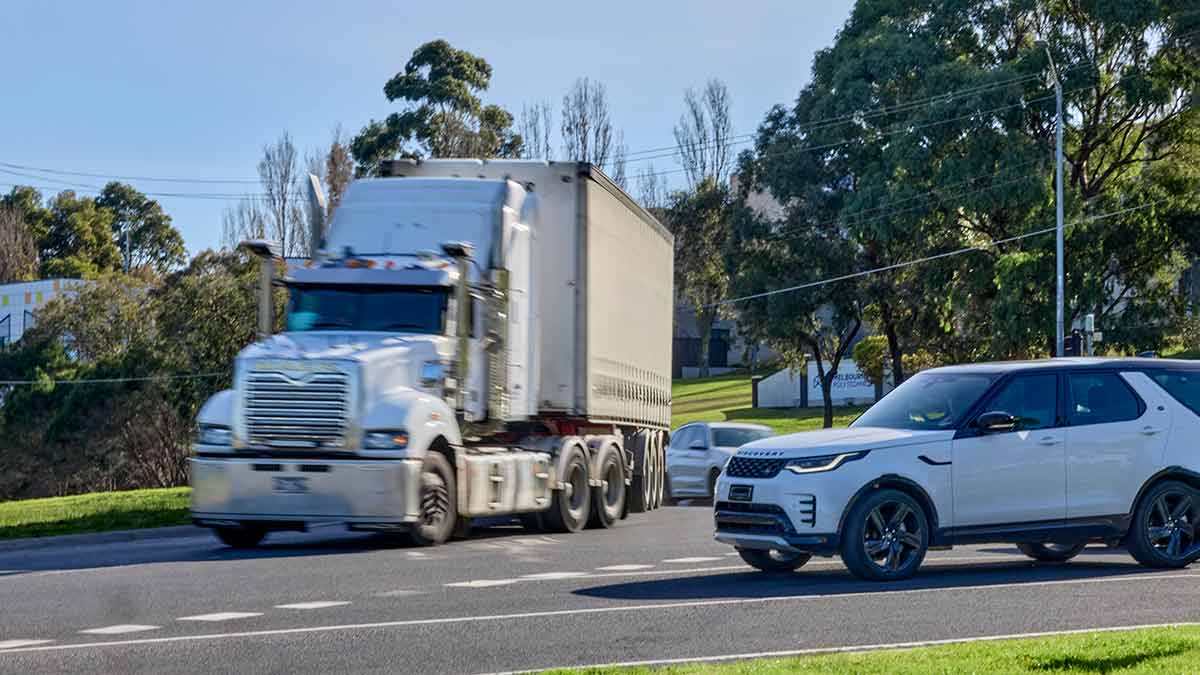 Truck and car at roundabout