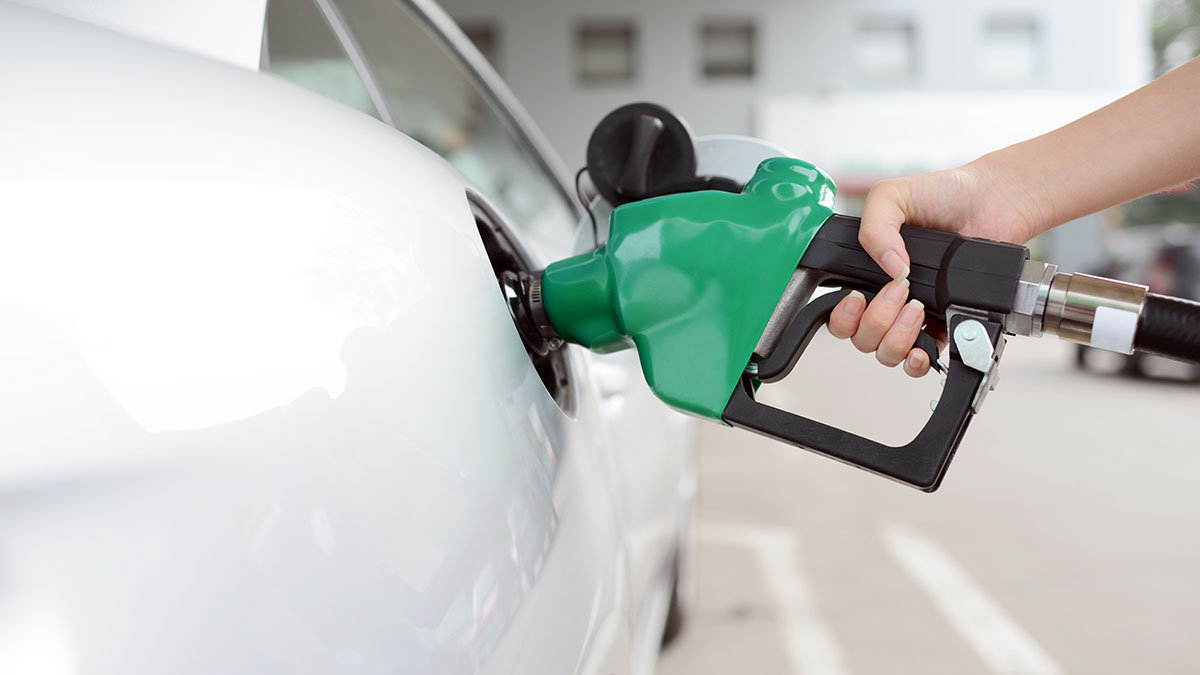 A person refuelling their petrol car