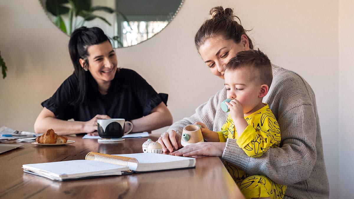 family of four unboxing items in the kitchen