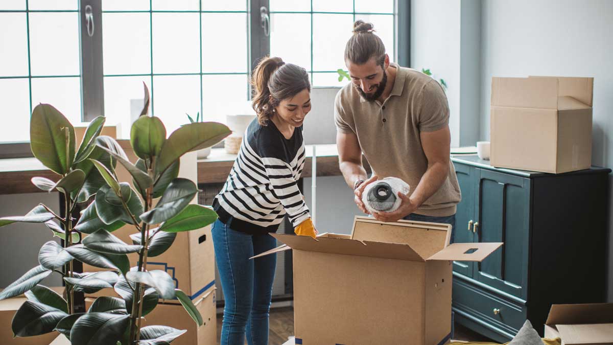 couple unpakcing boxes