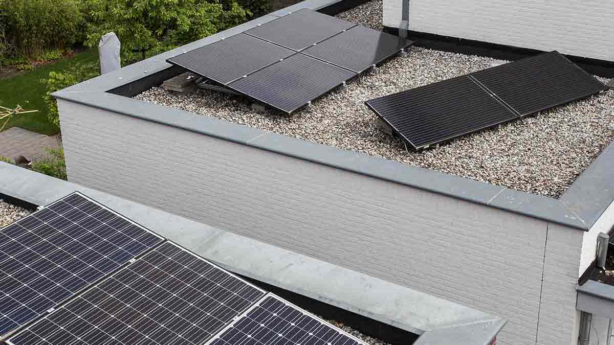 three black solar panels on a roof