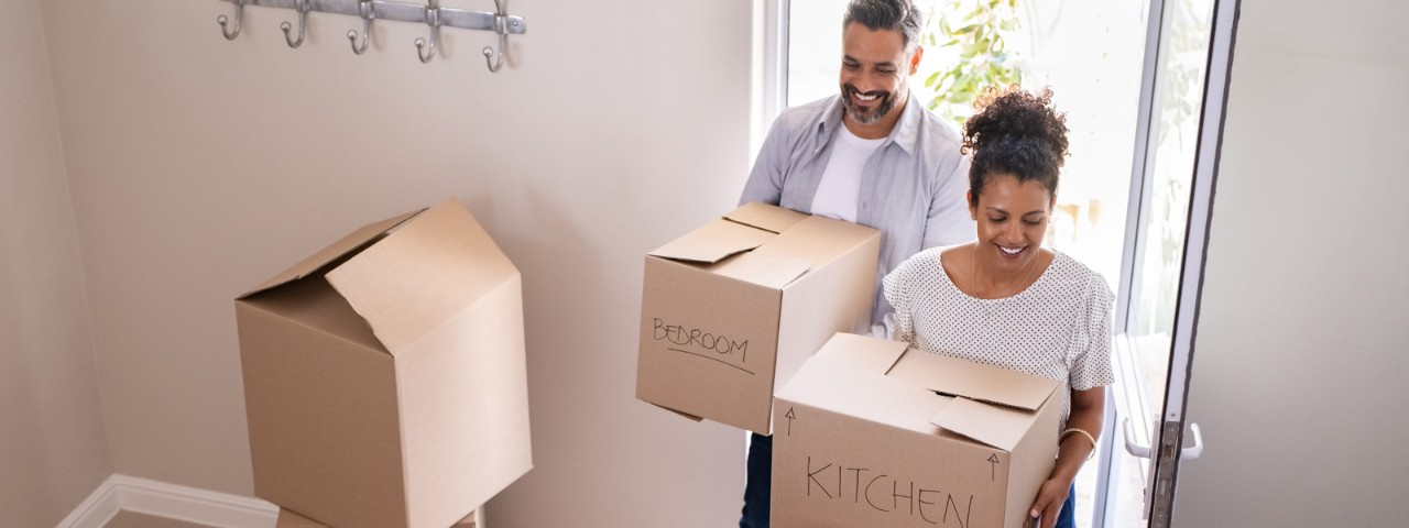 A couple with moving boxes