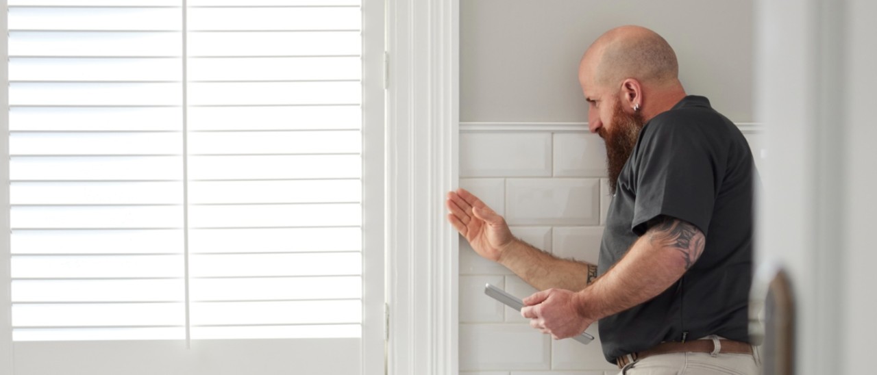 property inspector in bathroom