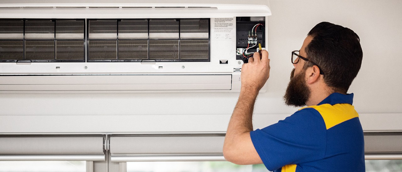 Qualified tradesperson fixing split system air conditioner