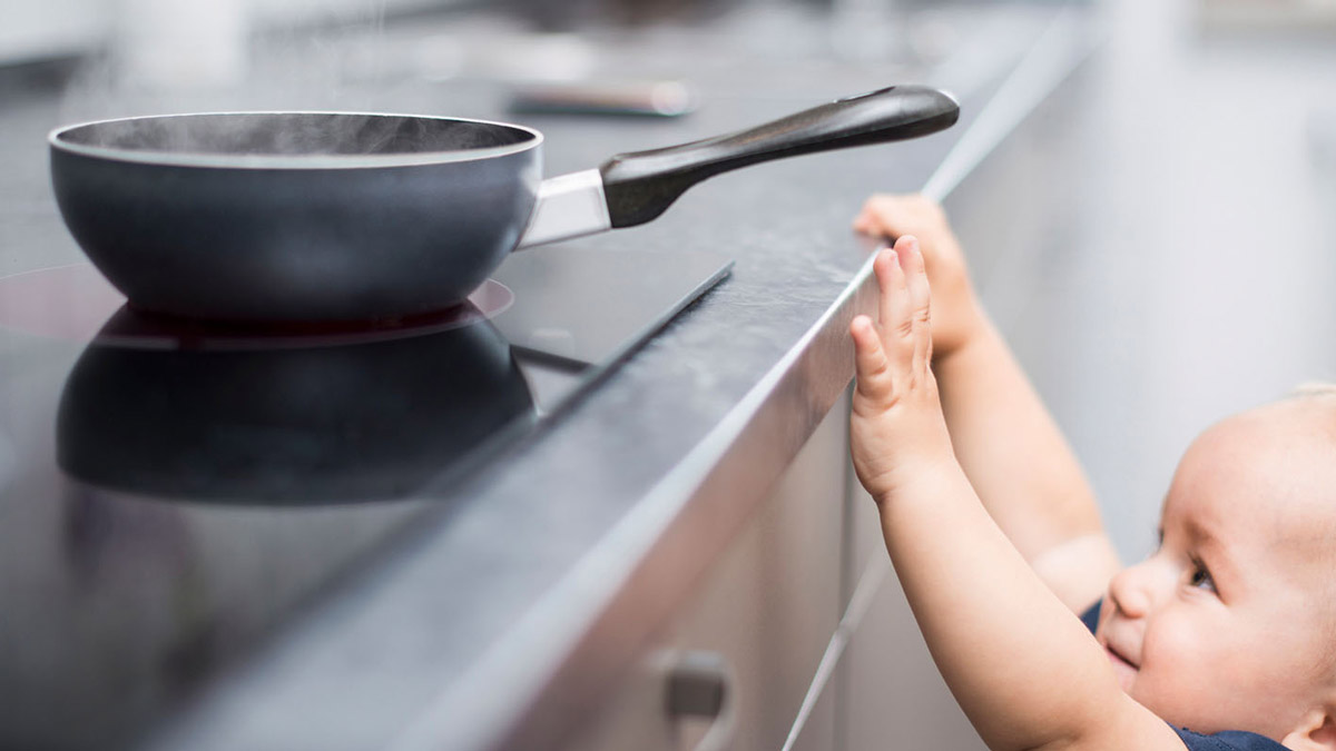 Toddler reaching for the stove