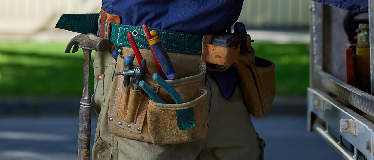 racv-trades-0358-1400x600.jpg Close-up of tradie wearing tool belt