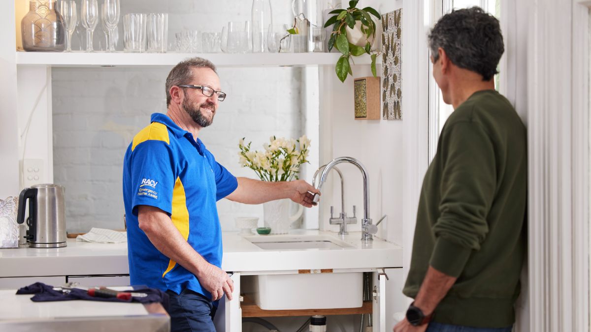 RACV plumber talking to homeowner about kitchen tap
