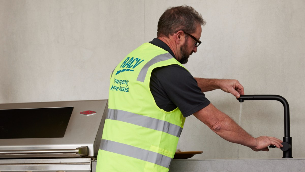 RACV plumber fixing a faucet