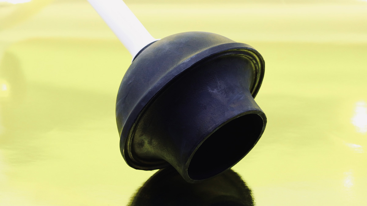 A black flange plunger used for clogged toilets