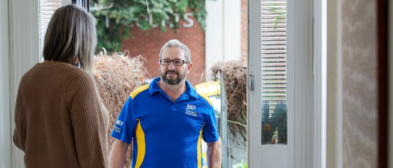 RACV EHA tradie greeting homeowner at her front door