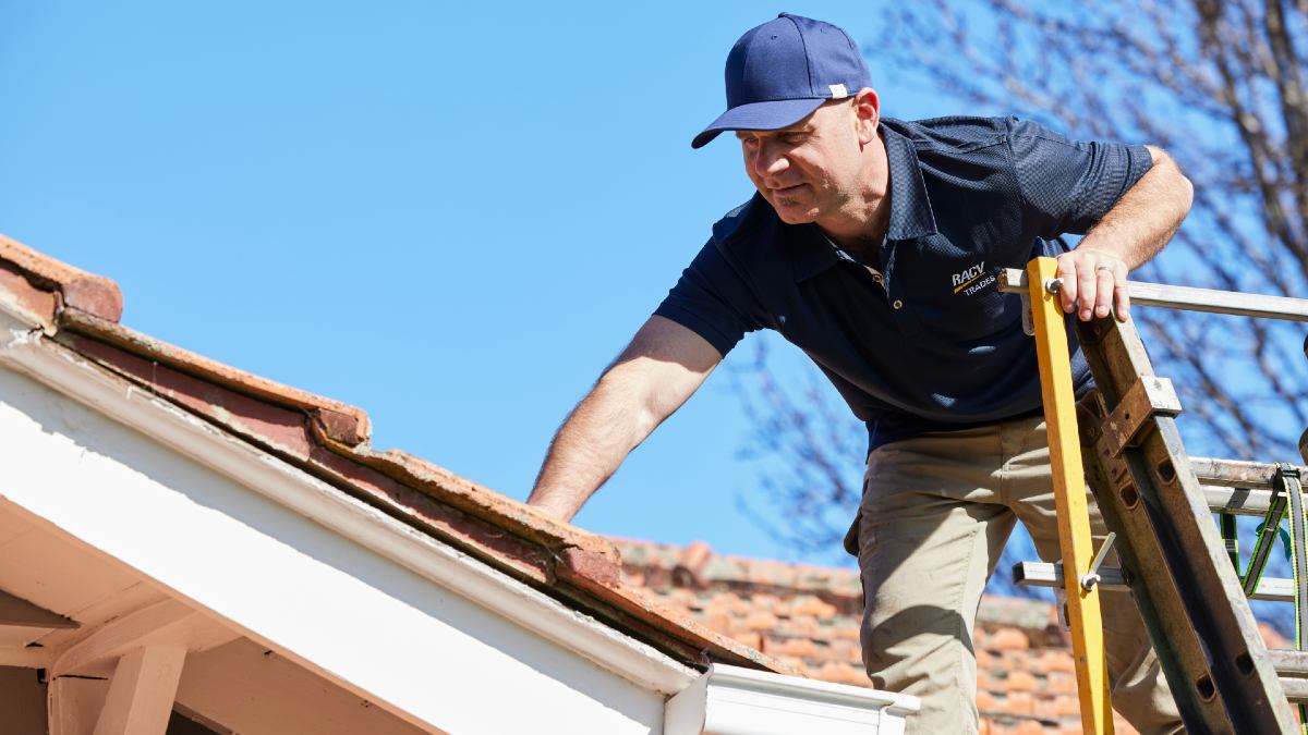 RACV tradie climbing onto roof