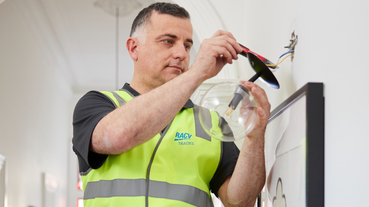 RACV electrician testing lightbulb