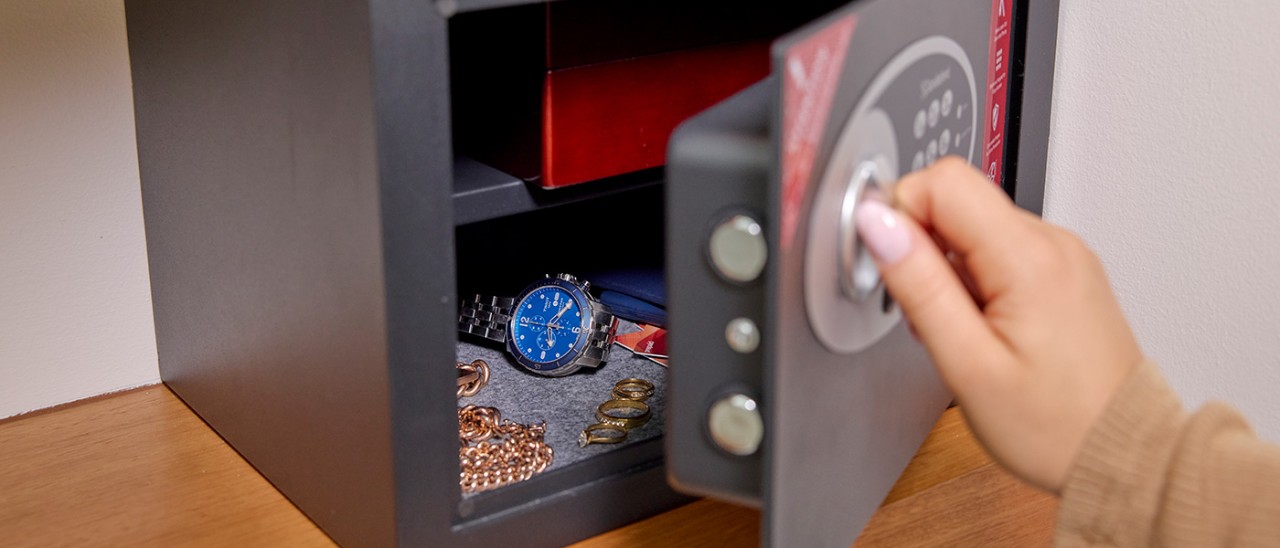 person unlocking a home safe