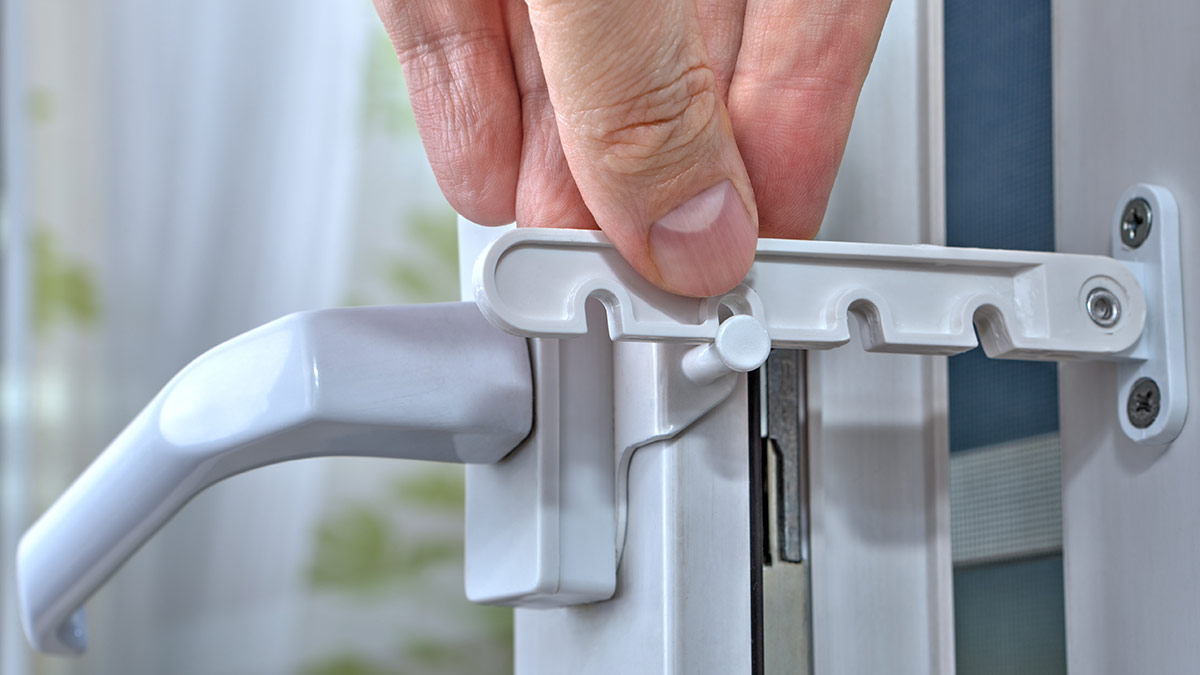 person using pin lock on window