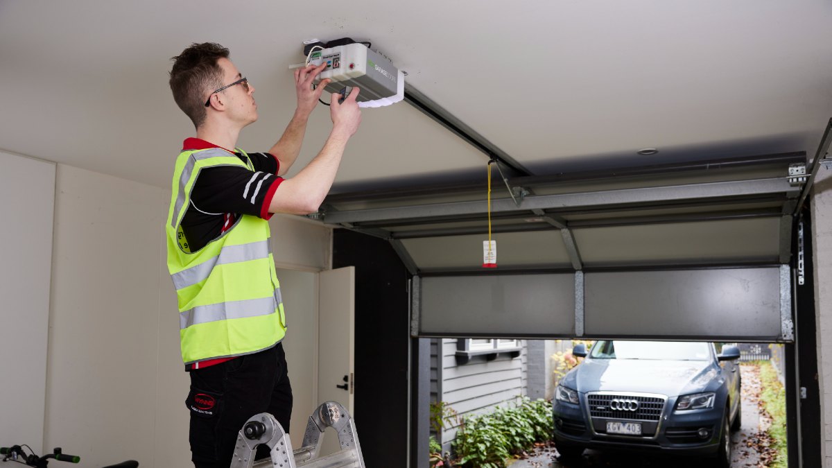 tradie fixing garage door