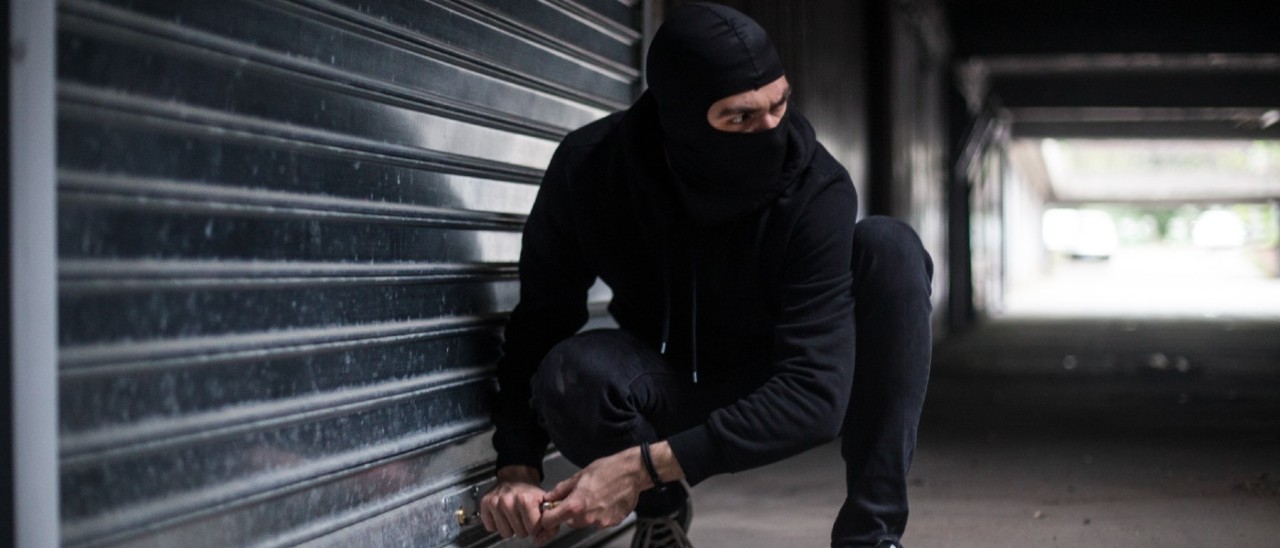 burglar breaking into a garage
