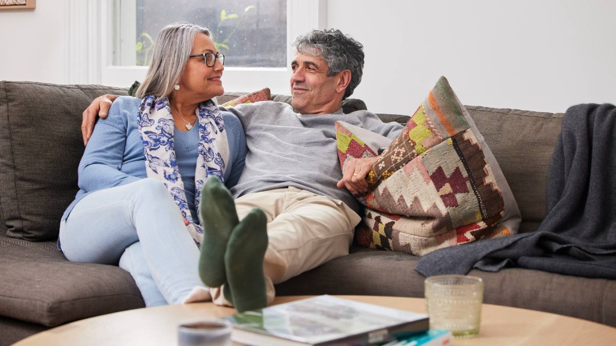 senior couple relaxing on couch